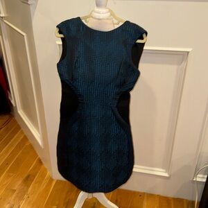 Beautiful black and blue dress with flattering design. Sturdy material size 6